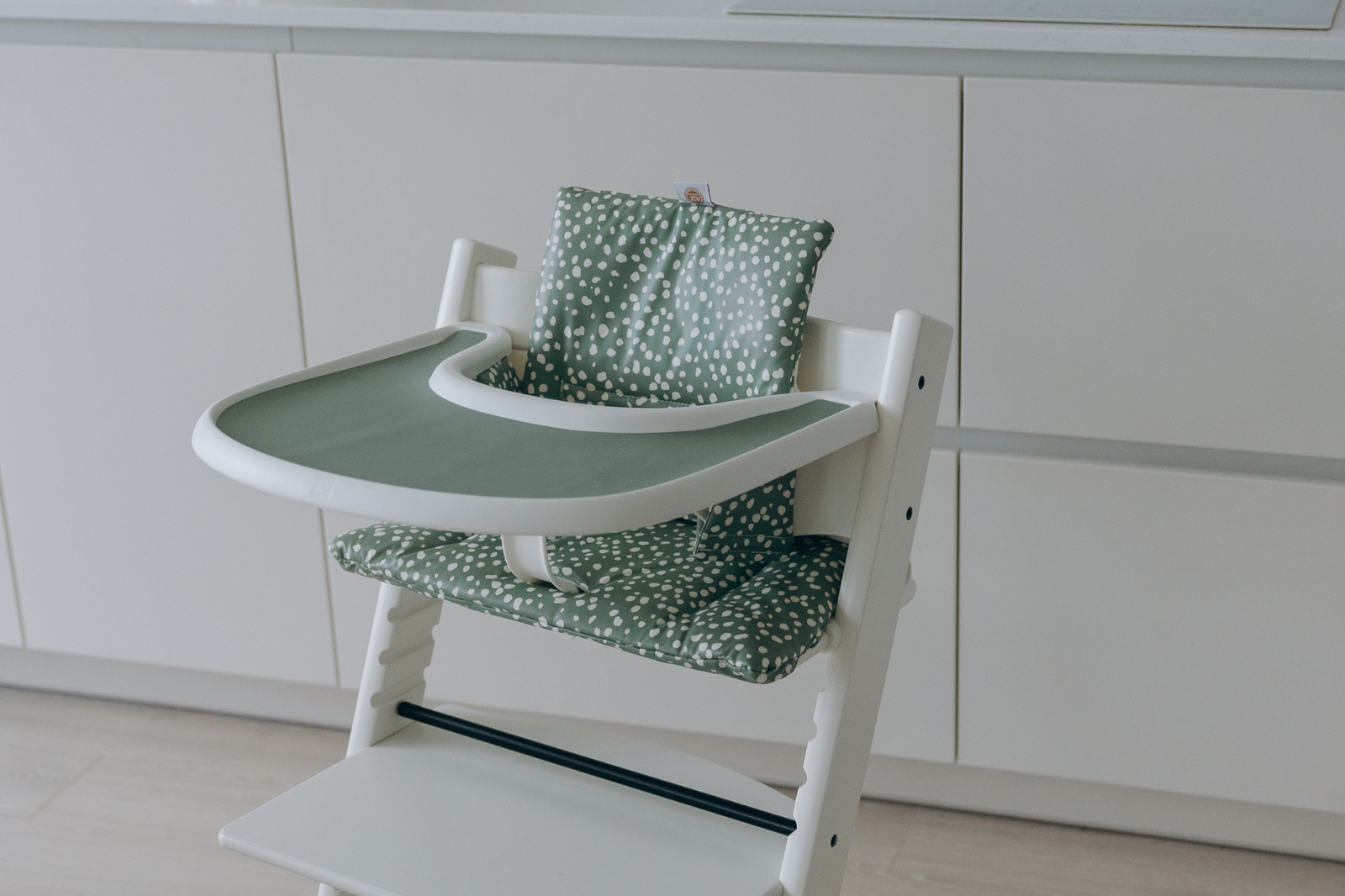 Stokke highchairs with wipe-clean cushion in sage print and silicone placemat in sage by AZEbabydream