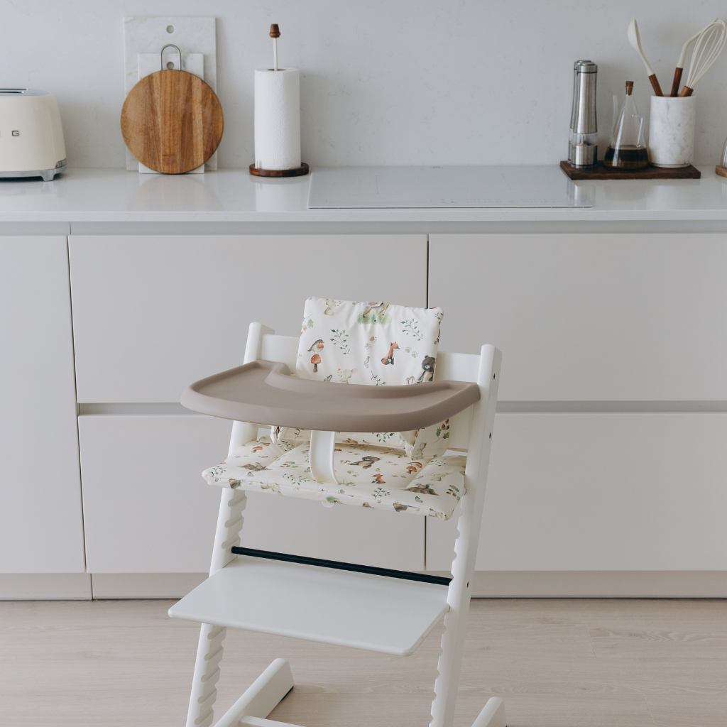 Stokke highchairs with wipe-clean cushion in woodland print and silicone placemat in taupe by AZEbabydream