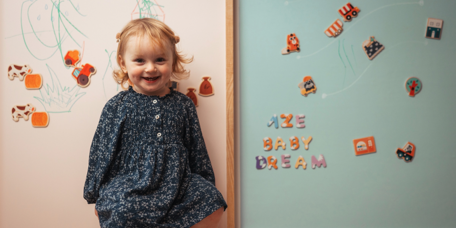 Baby playing with Pink Magnetic chalkboard in house shape by AZEbabydream