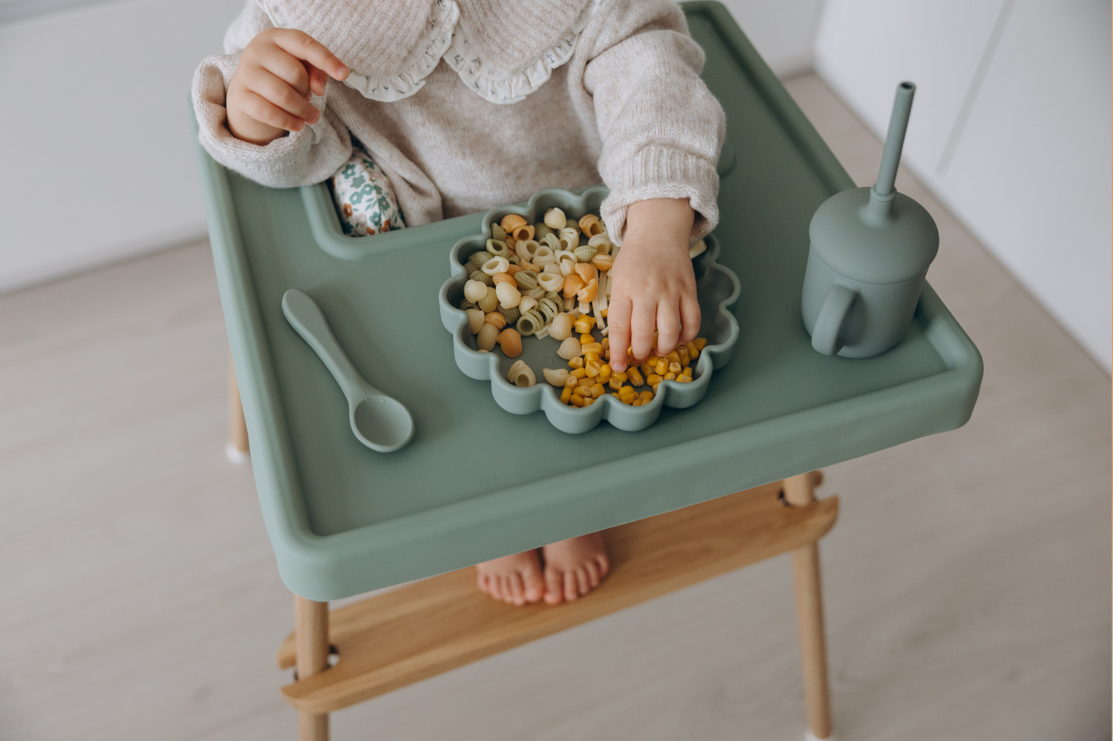 Baby seated in ikea highchairs and eating from sage suction plate by azebABYDREAm