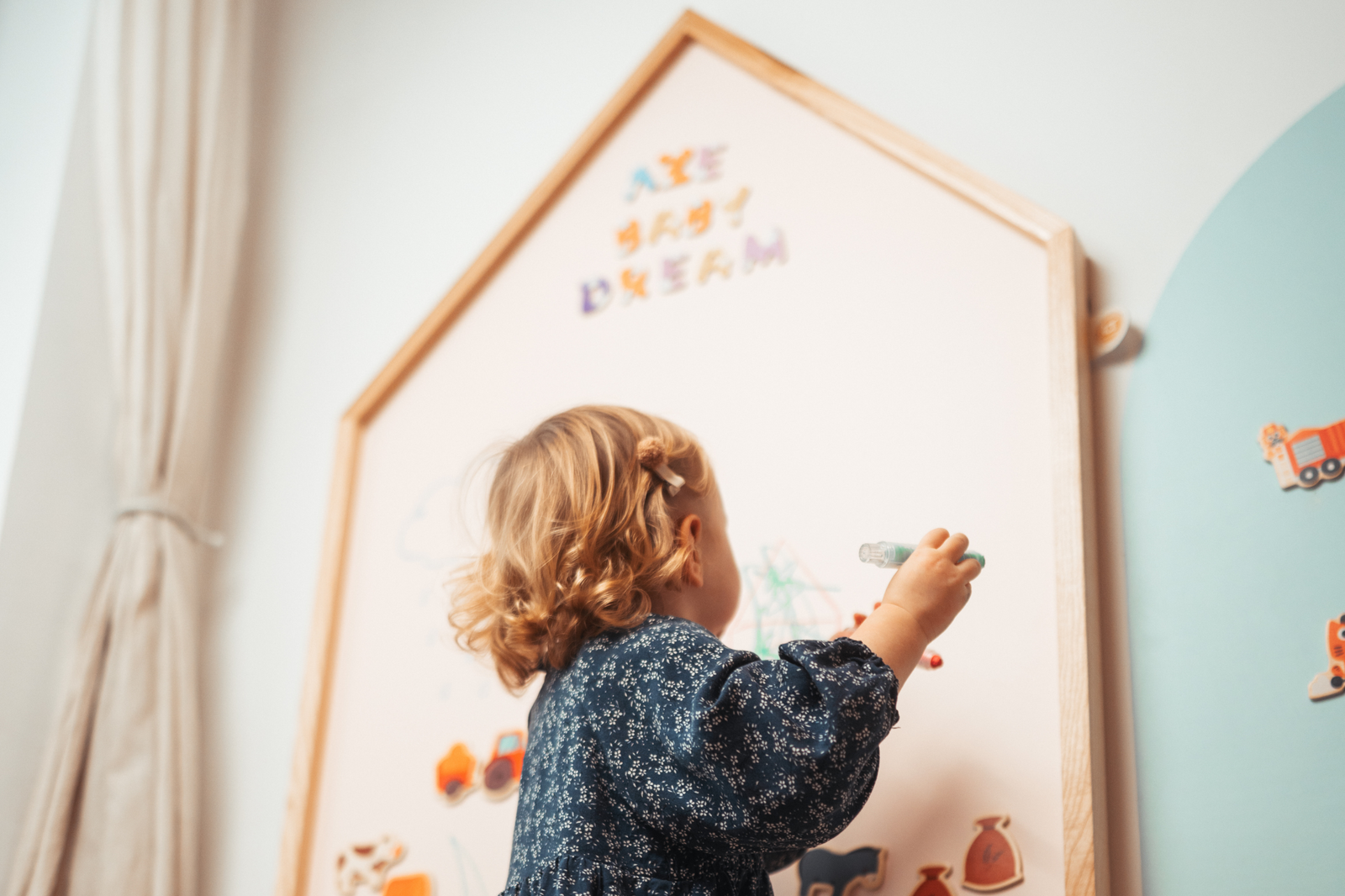 Toddler playing with Pink Magnetic chalkboard in house shape wooden frame from ash wood by azebABYDREAm 